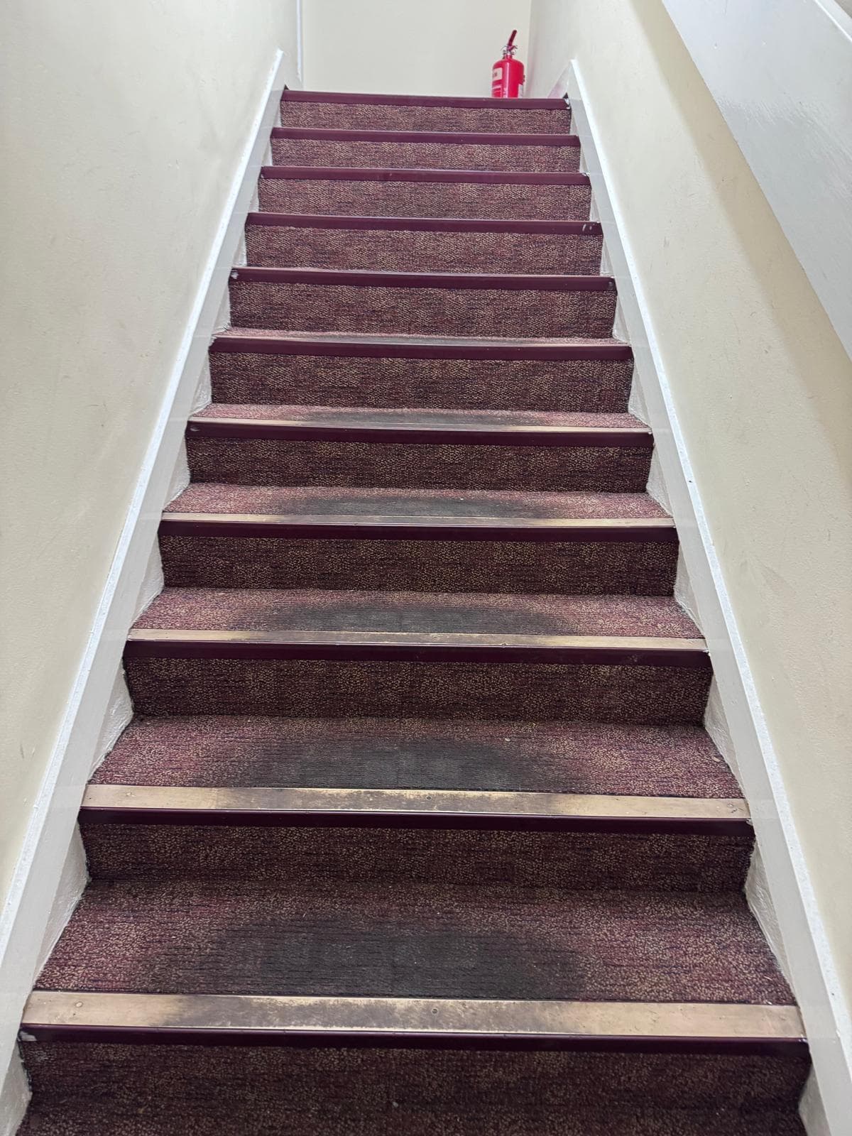 Office stair runner before clean – heavy traffic staining