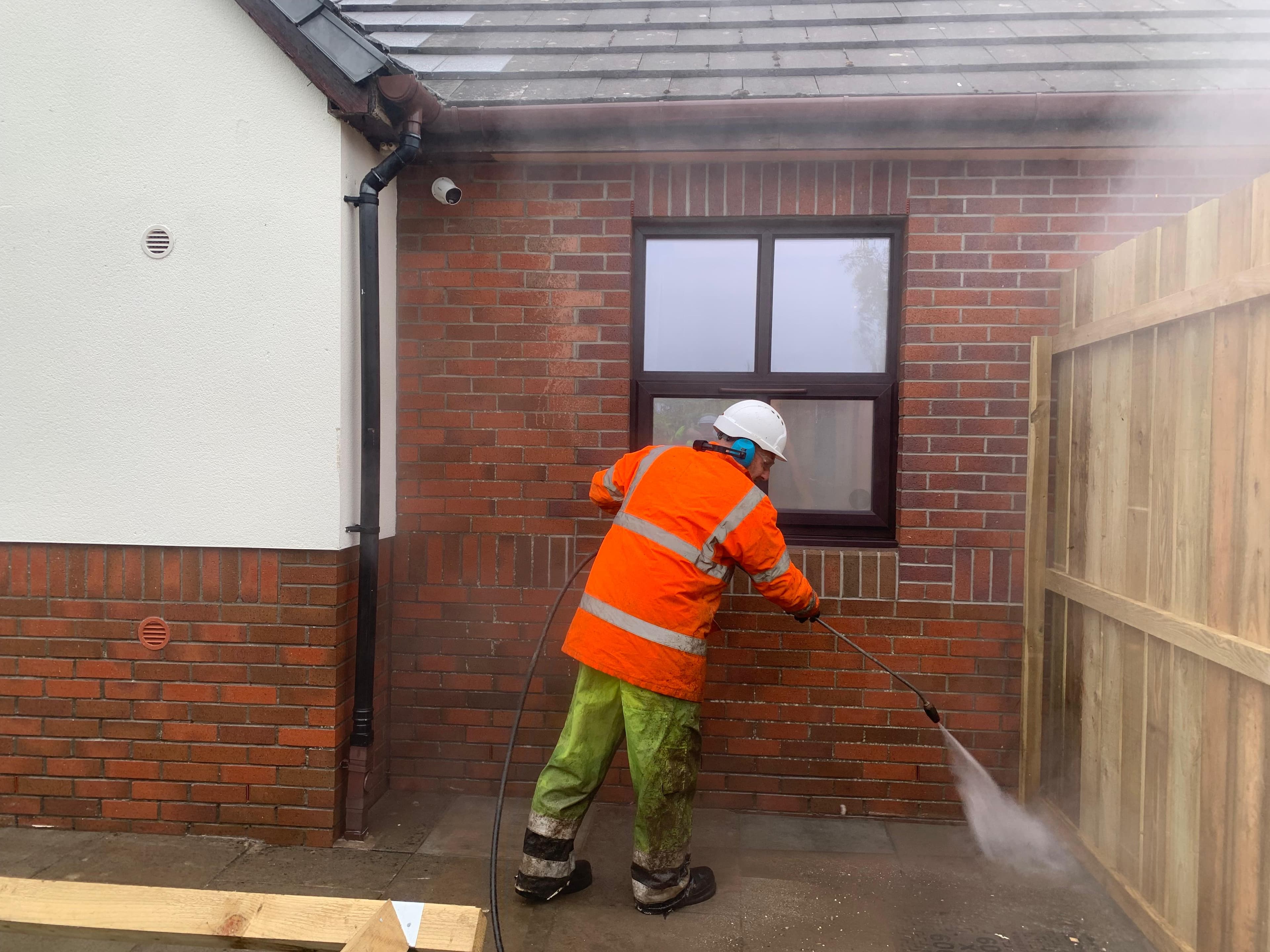 Brick elevation jet wash in PPE
