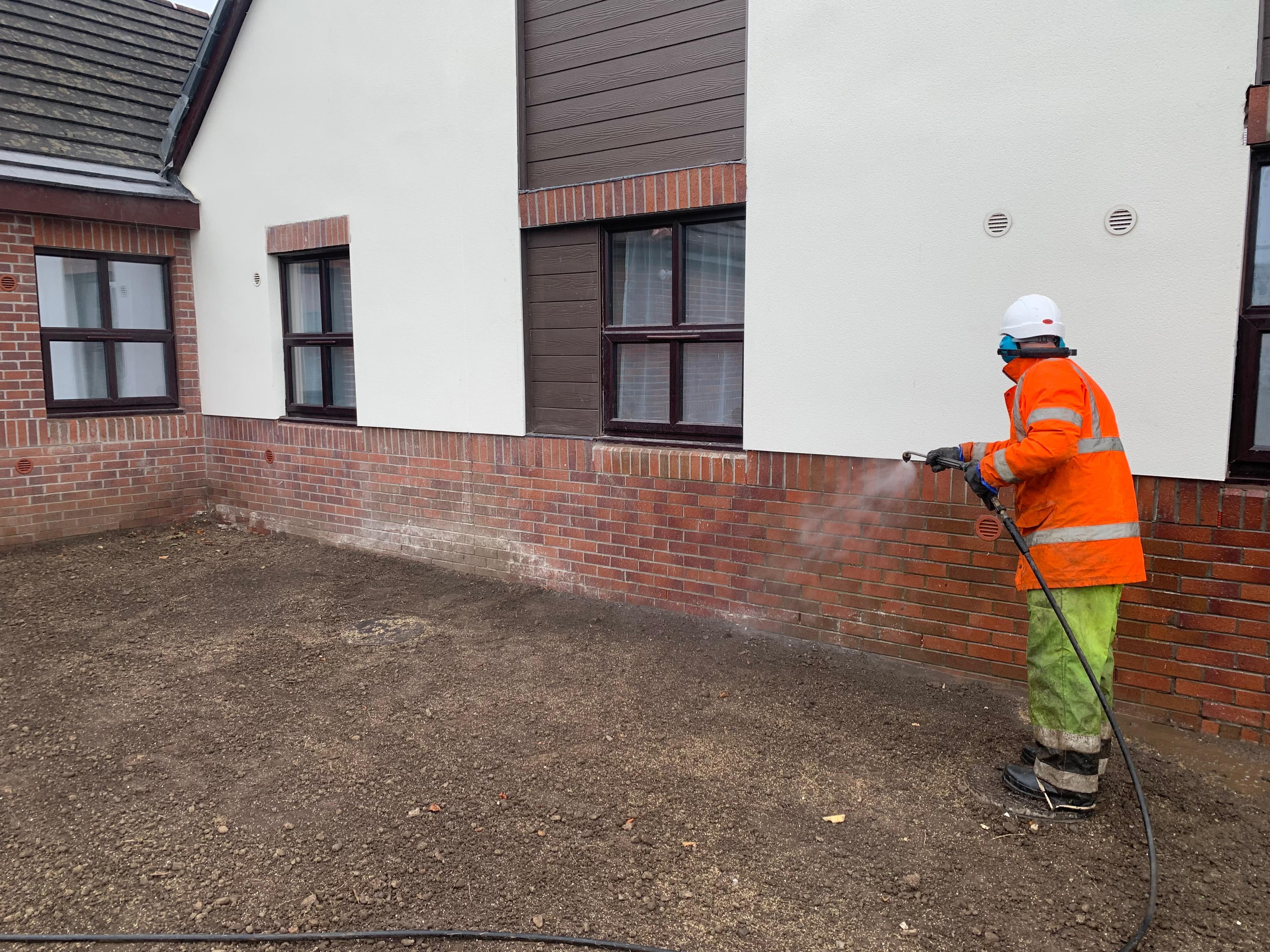 Final clean of brickwork and render