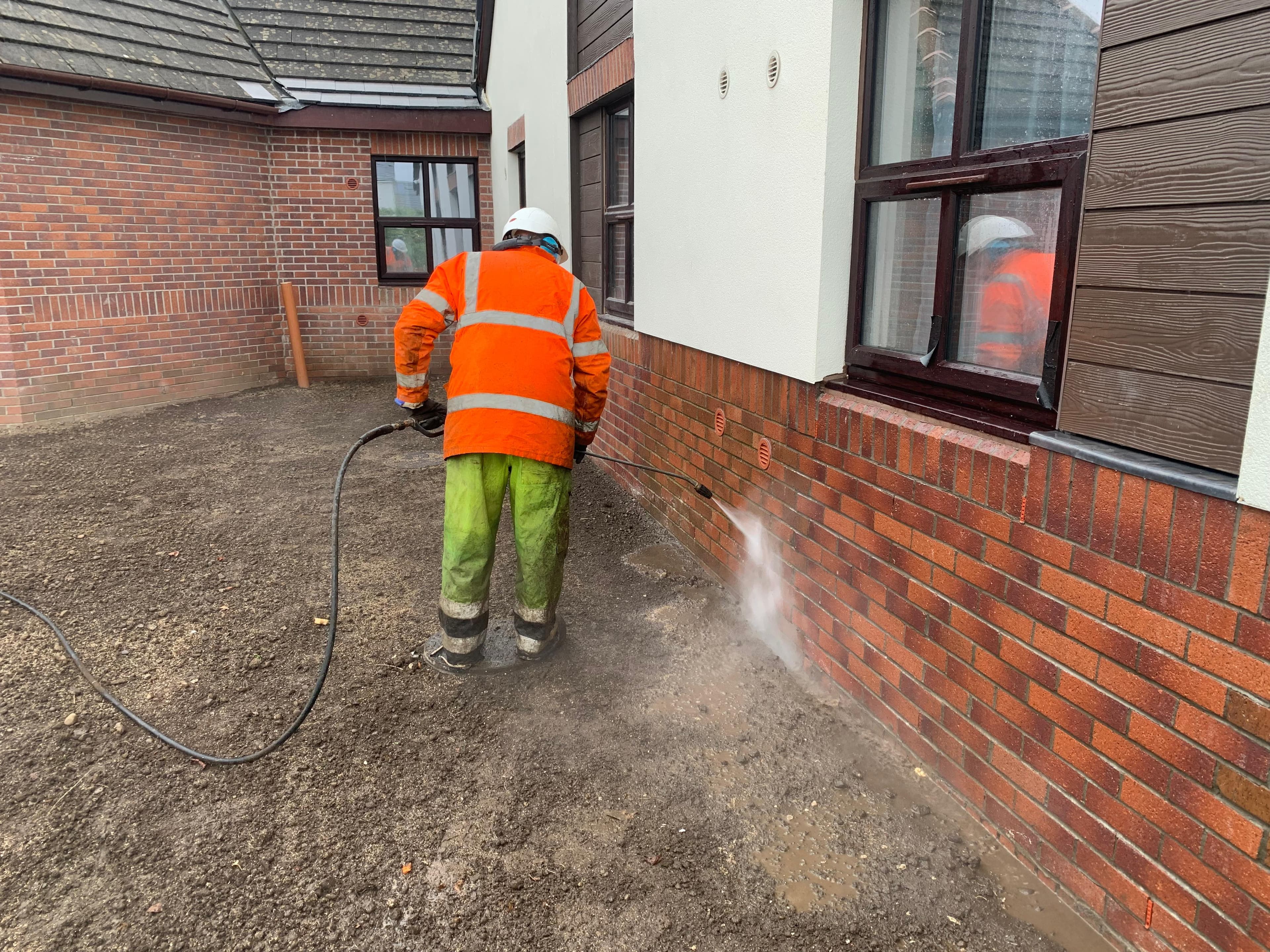 Brick wash on red elevation