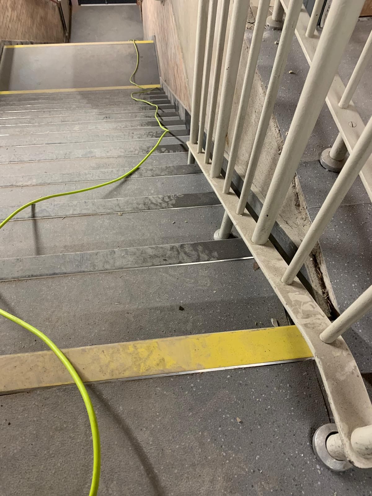 Stairwell before clean – dust and debris