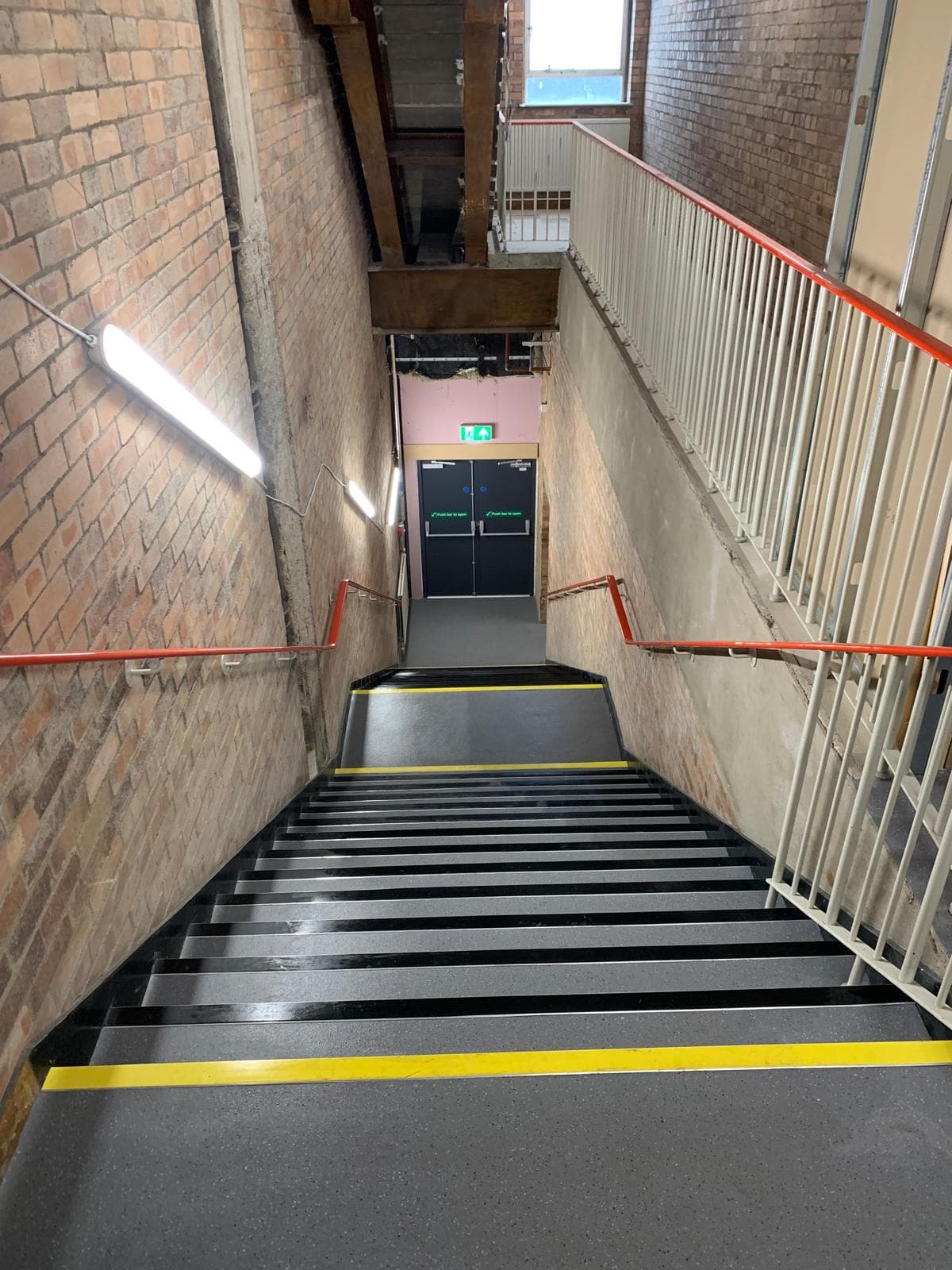 Painted brick walls and clean treads