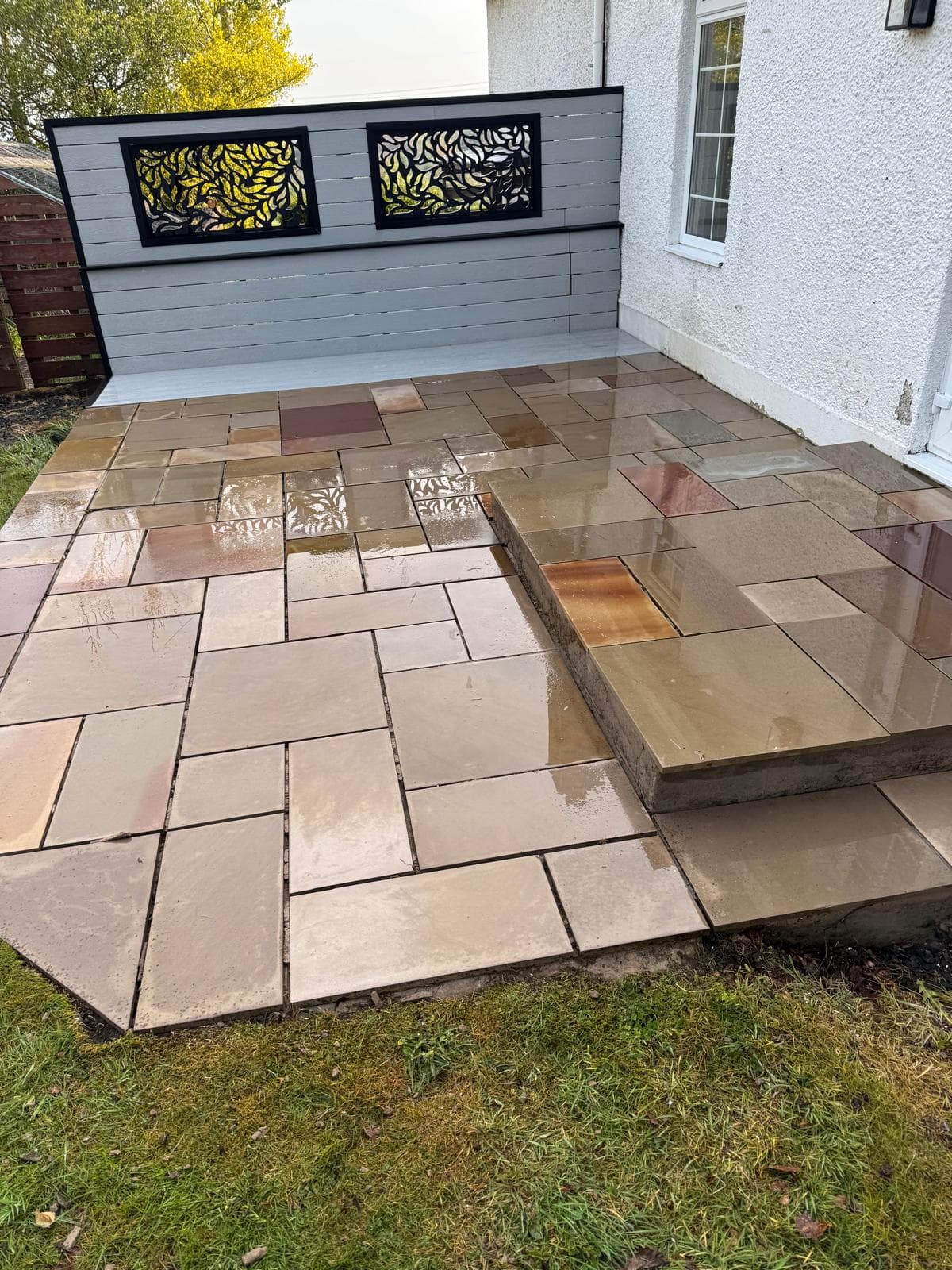 Sandstone patio restored to warm tones