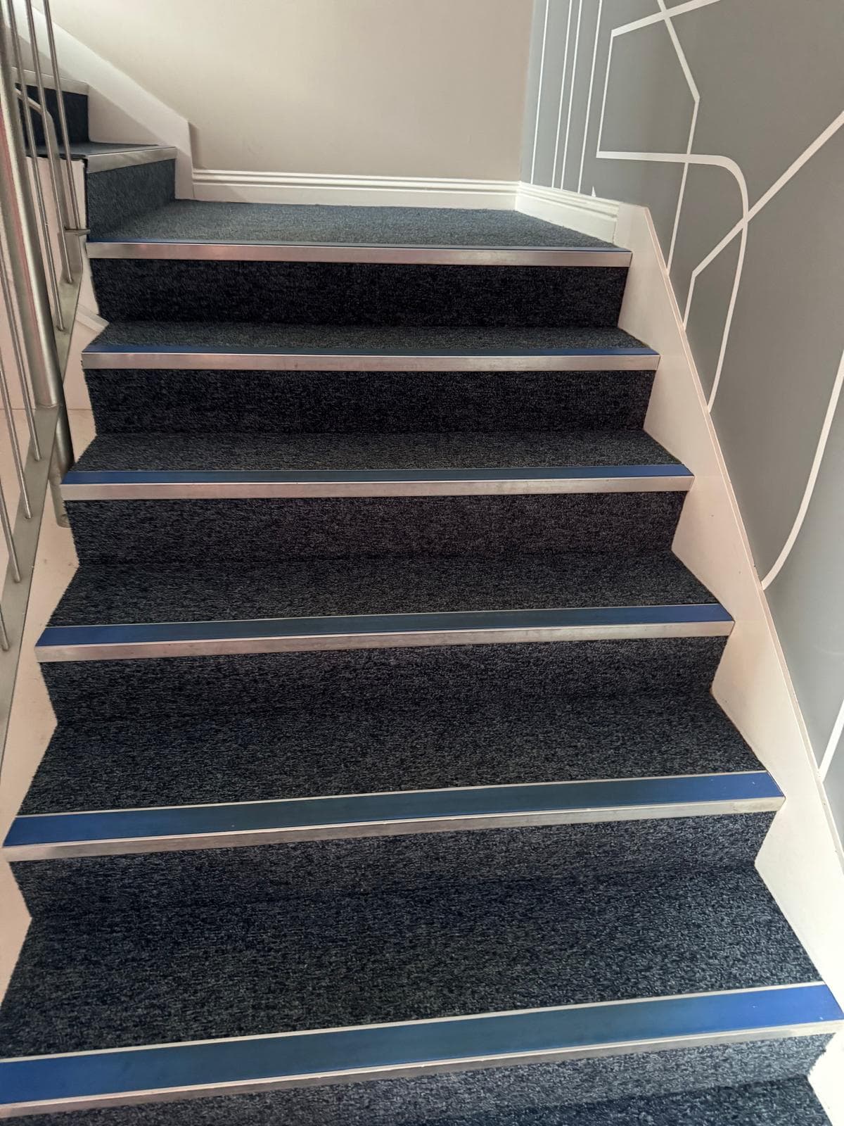 Carpet restored to deep navy tone