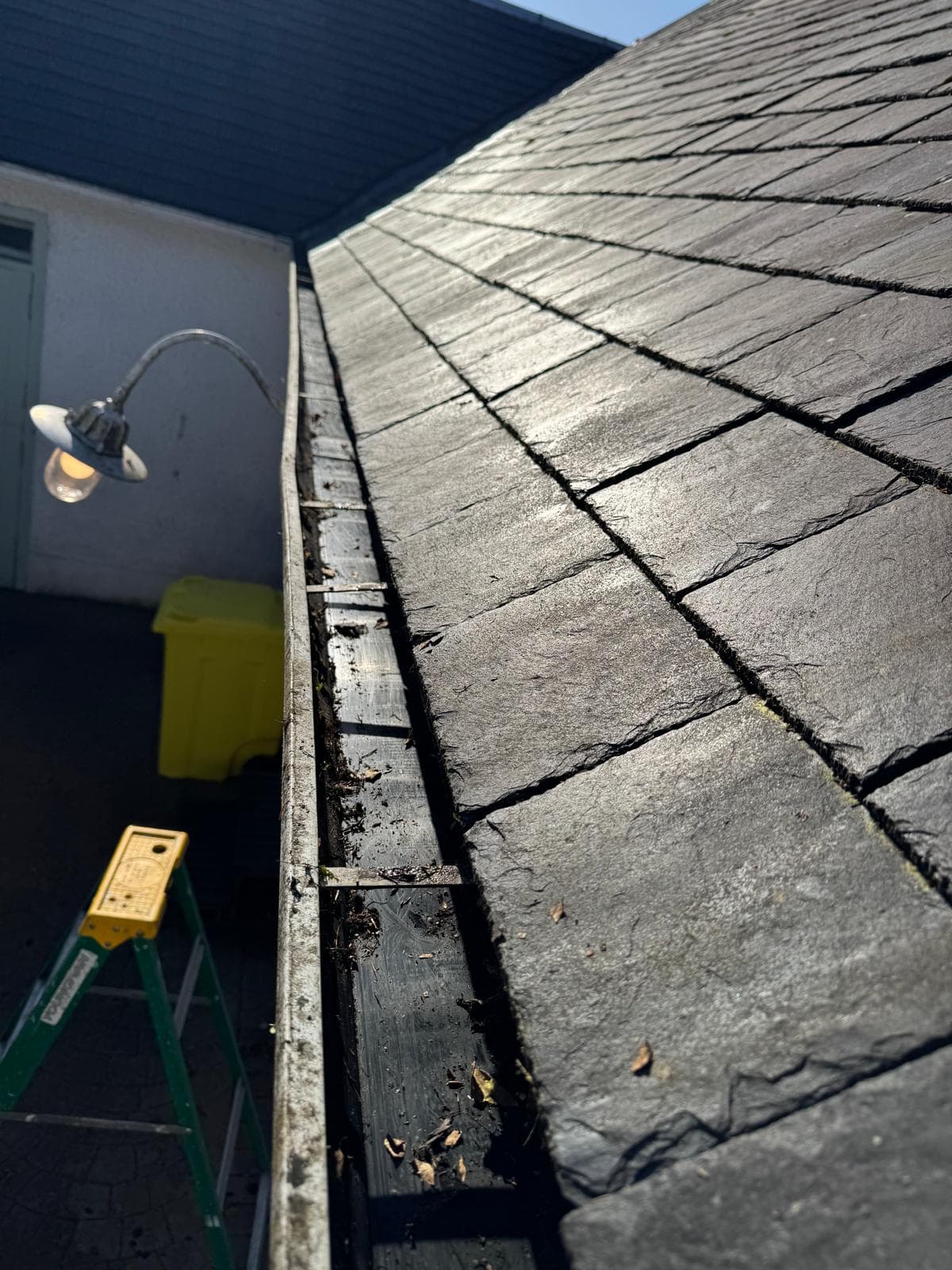 High-reach pole at slate roof line