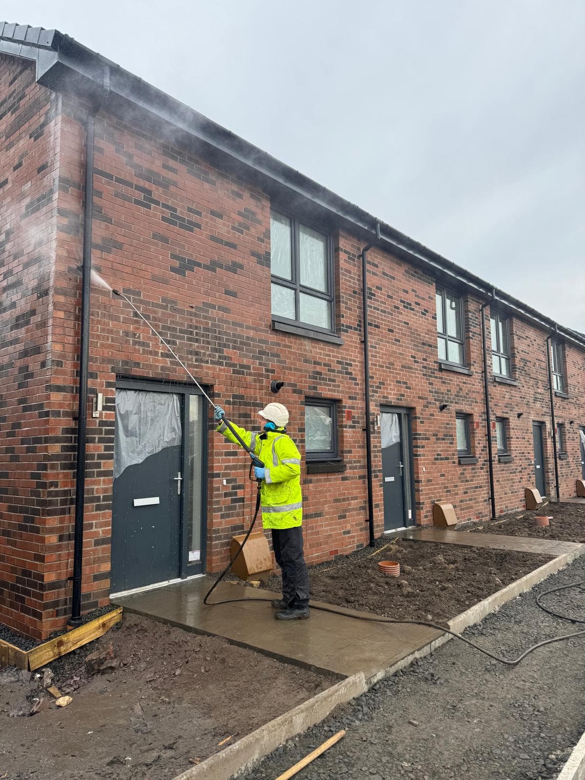 Mortar splatter being lifted from brick
