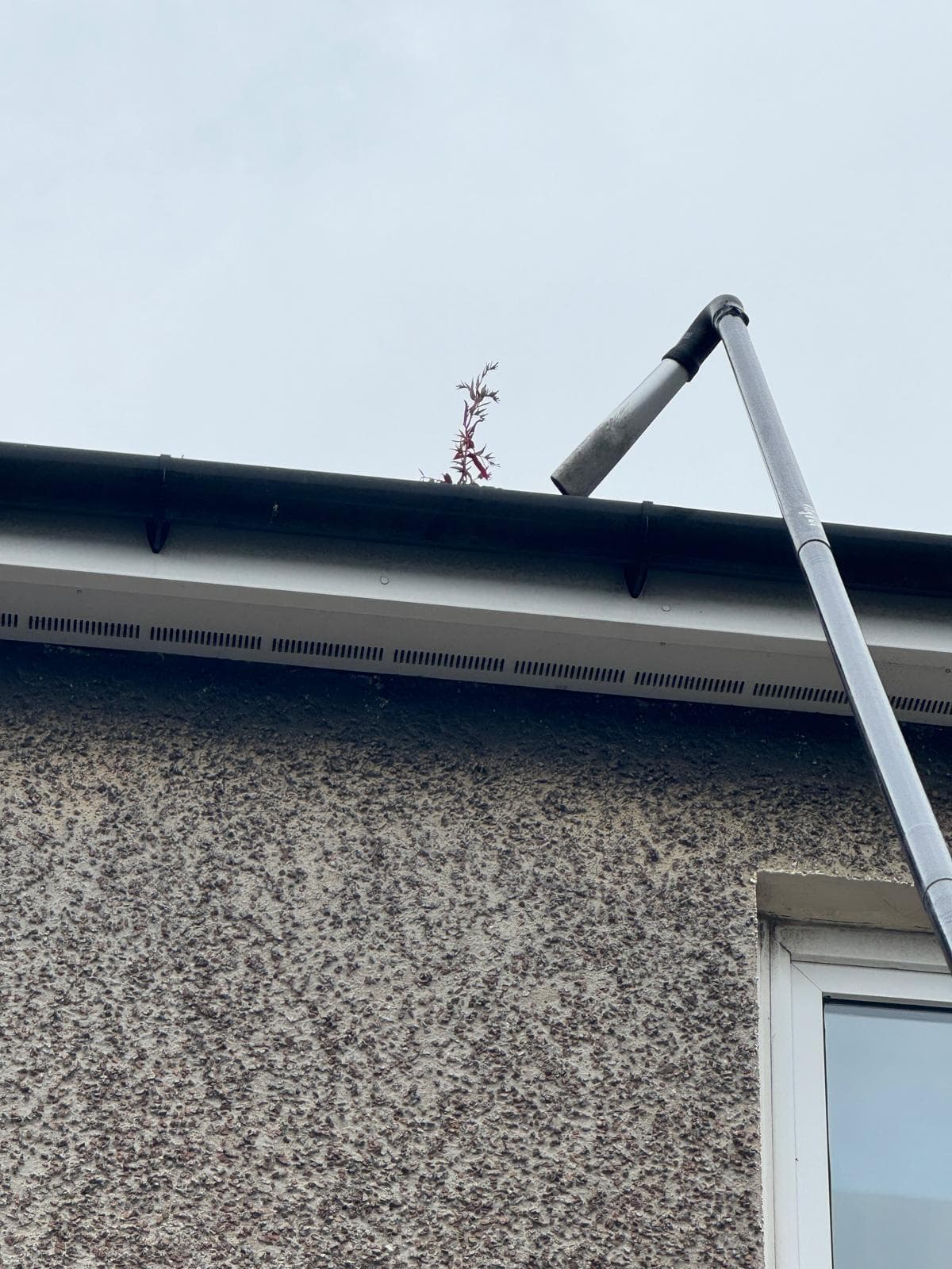 Gutter clearing in progress