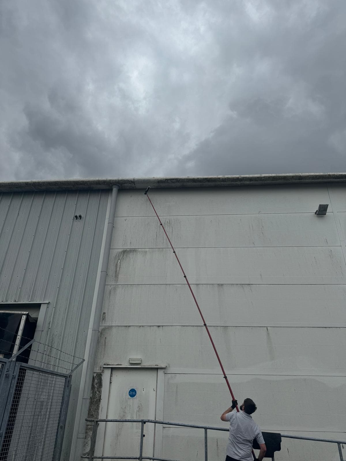 Algae stripped from white profiled cladding