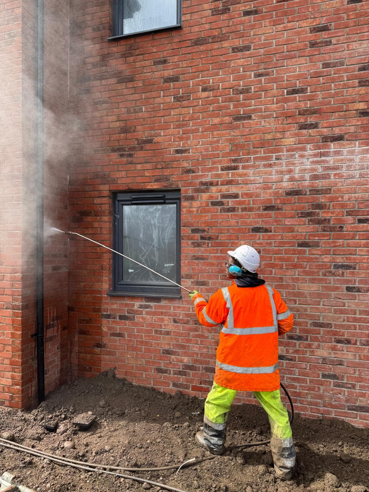 New-build flat block during brick clean