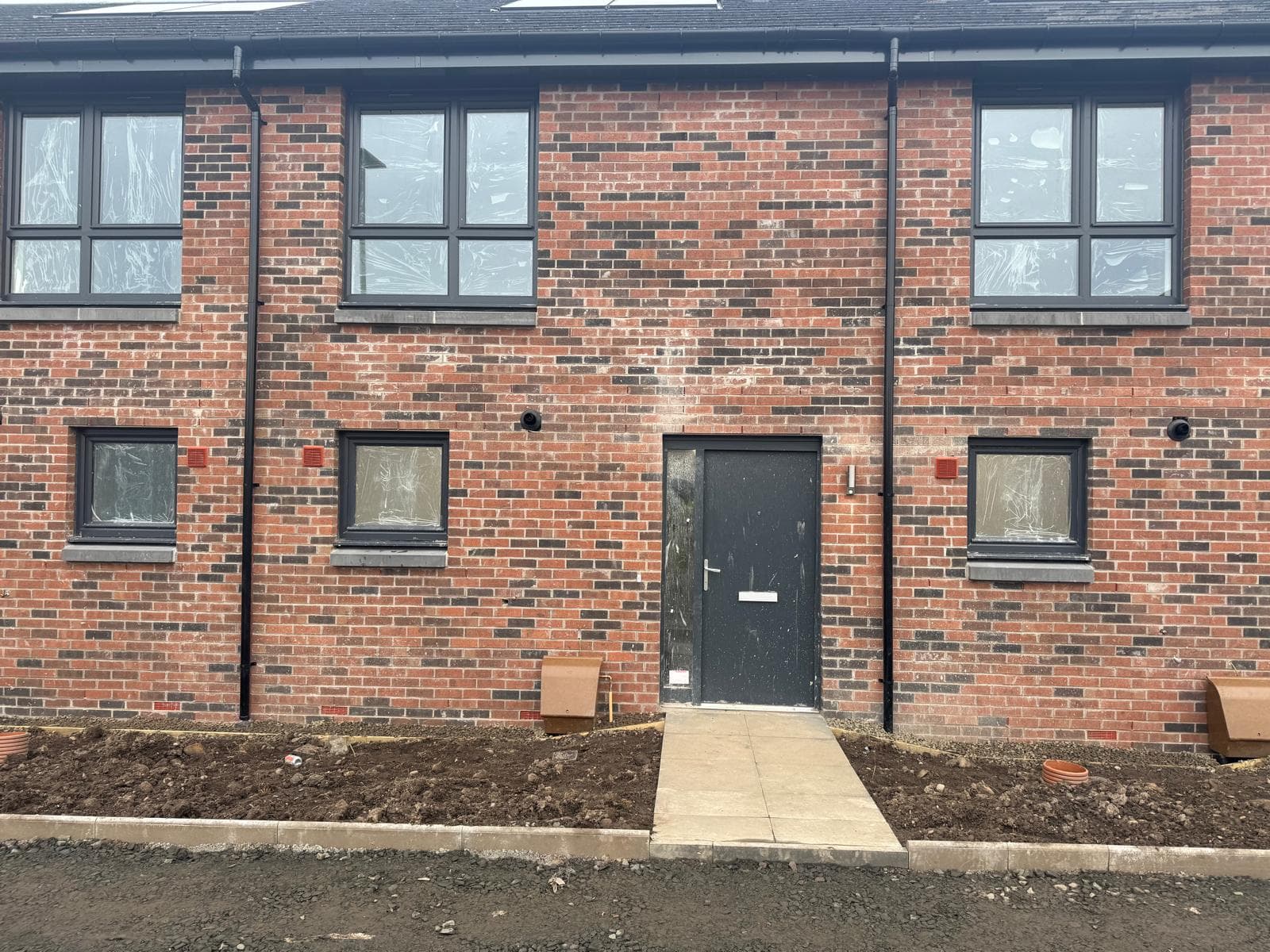 AS Homes new-build brick terrace mid-clean